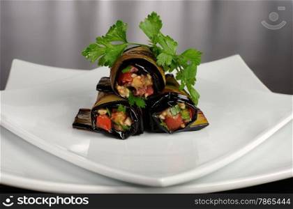 Rolls of fried eggplant stuffed with vegetables
