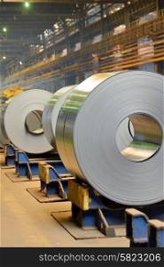 Rolls of metal sheet inside of steel plant