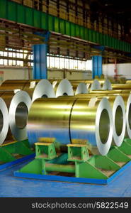 rolls of steel plate stored in warehouse