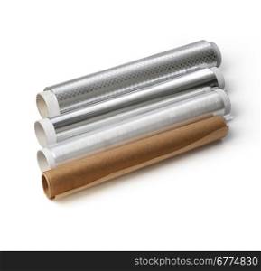 Rolls of wrapping plastic stretch film, baking paper and foil food on white background. with clipping path