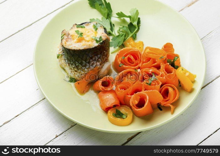 Rolls stuffed with minced fish and vegetable garnish. Diet food. Tasty fish rolls, fish appetizer