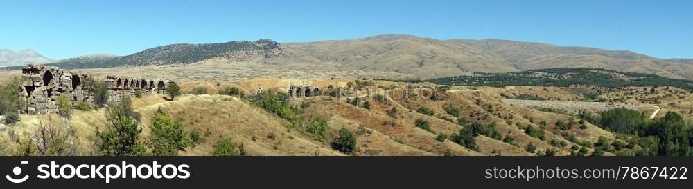 Roman aqueduct and panorama of farmland in Turkey