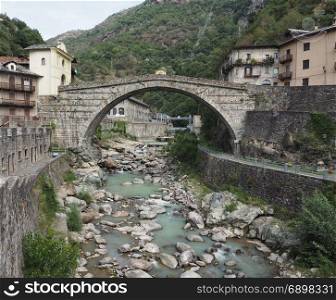 Roman bridge in Pont Saint Martin. Ancient roman bridge over torrent Lys in Pont Saint Martin, Italy