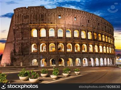 Roman Colosseum illuminated at sunset, Romw, Italy.. Roman Colosseum illuminated at sunset, Romw, Italy