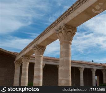 Roman Colums in Villa with Blue SKy and White Clouds