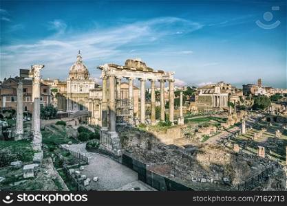 Roman Forum in Rome , Italy . Roman Forum was build in time of Ancient Rome as the site of triumphal processions and elections. It is famous tourist attraction of Rome , Italy .