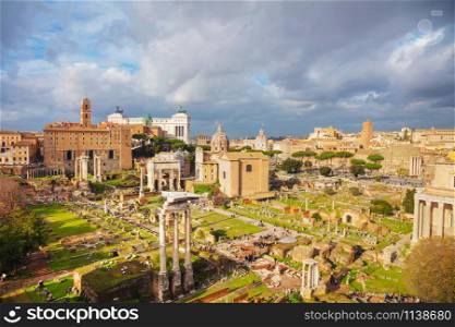 Roman forum ruins on a cloudy day in Rome, Italy