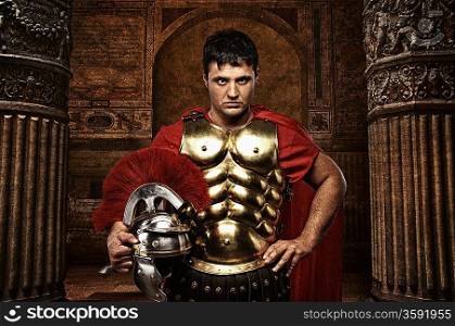 Roman soldier against antique building.