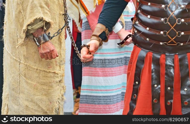 roman soldier and handcuffed prisoner