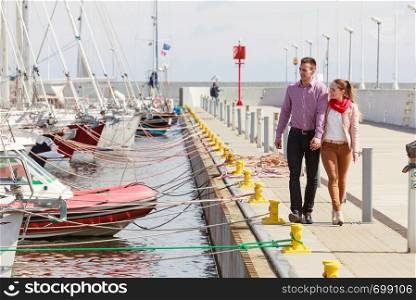 Romance, beautiful relationship concep.t Happy couple having romantic date in marina during spring. Happy couple having romantic date in marina