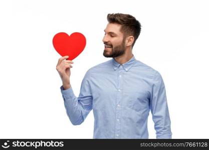 romance, love and people concept - happy smiling young man with red heart over white background. happy smiling young man with red heart