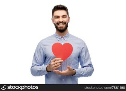 romance, love and people concept - happy smiling young man with red heart over white background. happy smiling young man with red heart