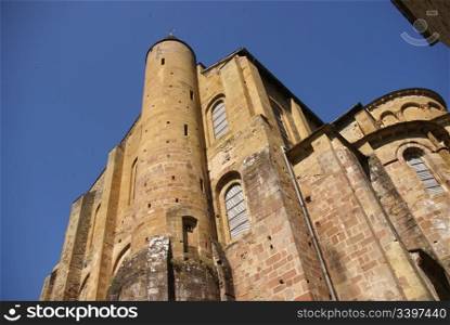 Romanesque tower and walls of the Abbey Church of St. Foy, Conques, France