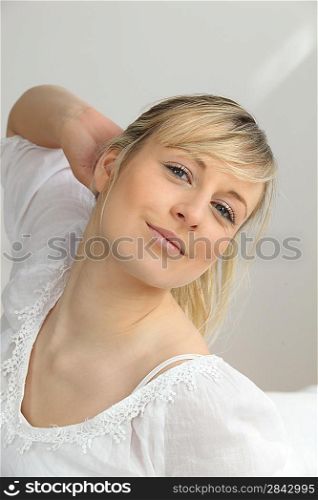 Romantic blonde woman in white