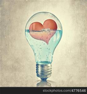 Romantic card. Glowing light bulb and red heart inside of it