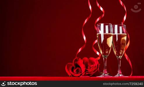 Romantic Celebration Of Valentine&rsquo;s Day With Champagne Wine And red Roses , red background with copy space. Romantic Celebration Of Valentine&rsquo;s Day