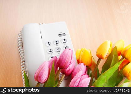 Romantic concept with phone and tulip flowers