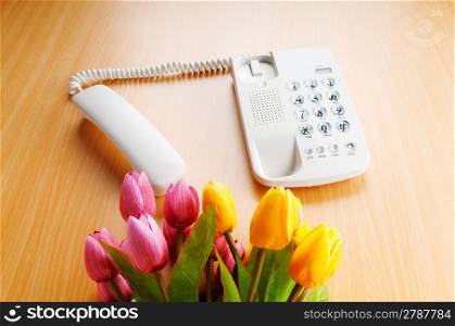 Romantic concept with phone and tulip flowers