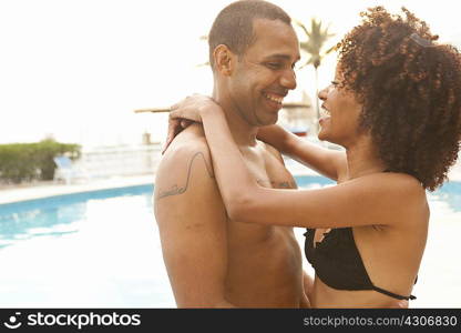 Romantic couple at hotel poolside, Rio De Janeiro, Brazil