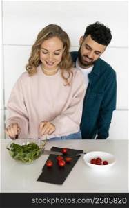 romantic couple cooking together home