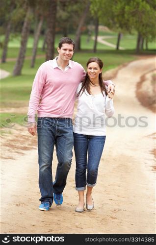 Romantic couple enjoying walk in park