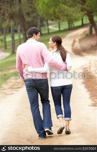 Romantic couple enjoying walk in park