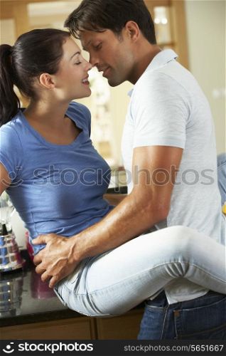 Romantic Couple Hugging In Kitchen