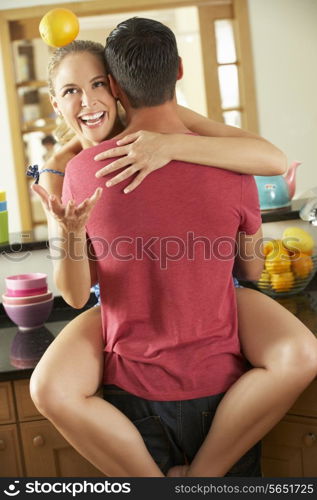 Romantic Couple Hugging In Kitchen