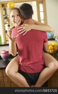 Romantic Couple Hugging In Kitchen