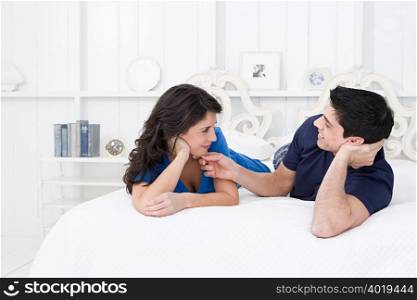 Romantic couple lying on bed