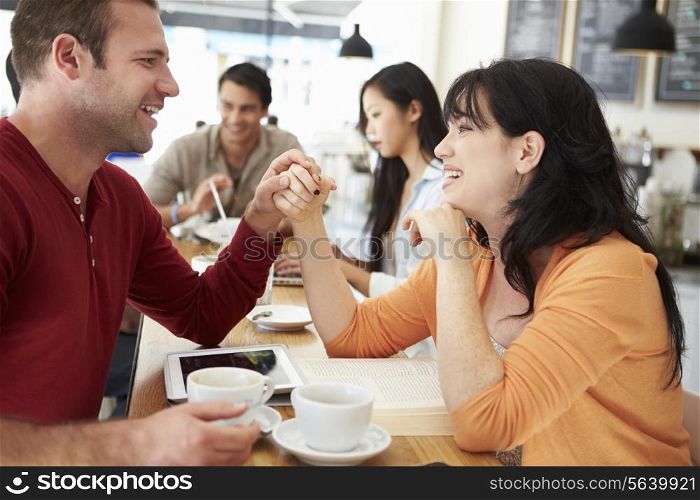 Romantic Couple Meeting In Busy Cafe