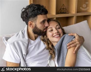 romantic couple sofa home holding each other