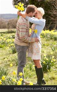 Romantic Couple Walking Amongst Spring Daffodils