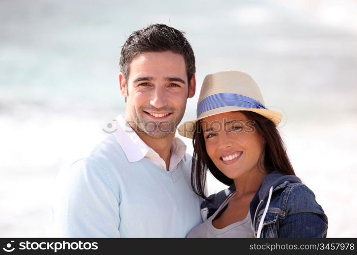 Romantic couple walking by the beach