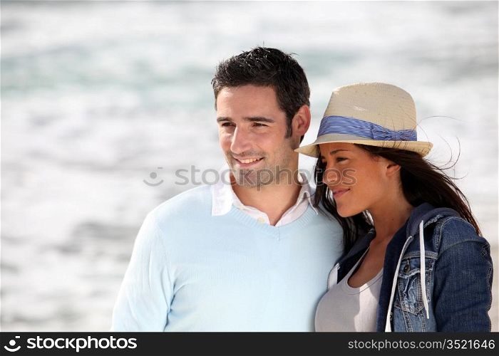 Romantic couple walking by the beach