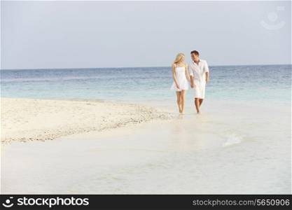 Romantic Couple Walking On Beautiful Tropical Beach