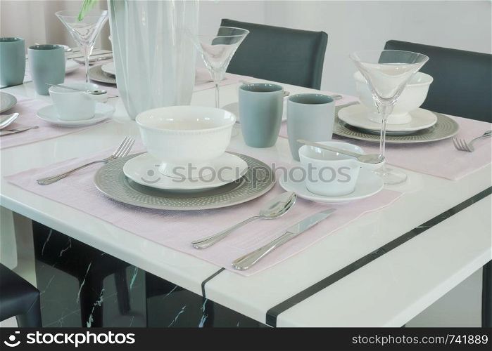 Romantic dining set with beautiful flower vase at the center of dining table