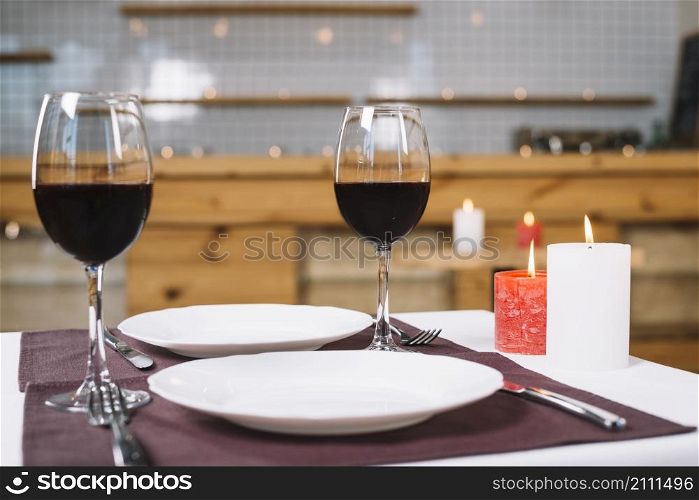 romantic dinner table with wine glasses