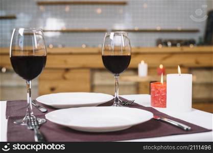 romantic dinner table with wine glasses