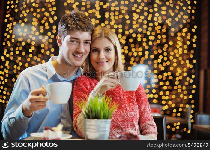 romantic evening date in restaurant happy young couple with wine glass tea and cake