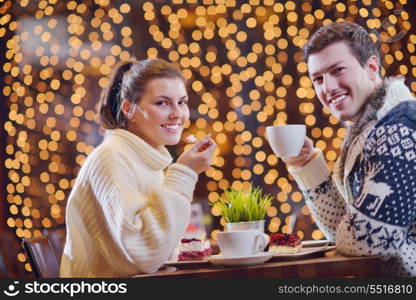 romantic evening date in restaurant happy young couple with wine glass tea and cake