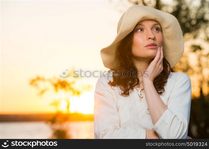 Romantic girl on the beach during sunset