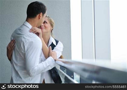 romantic happy couple relax and have fun at balcony in their new home apartment