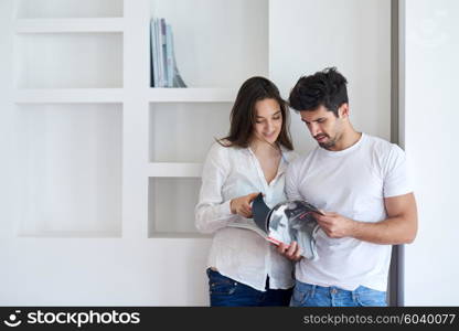 romantic happy young couple relax at modern home staircase indoors