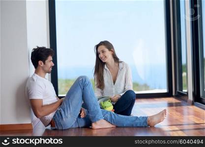 romantic happy young couple relax at modern home staircase indoors