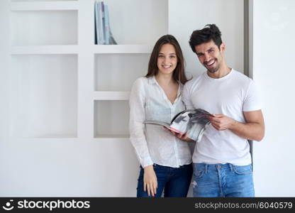 romantic happy young couple relax at modern home staircase indoors