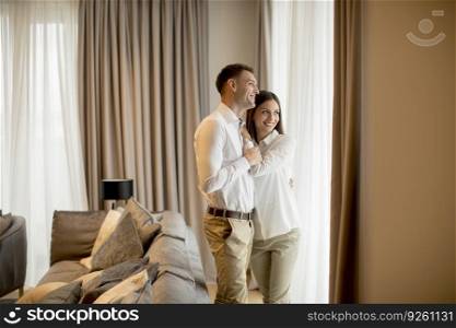 Romantic happy young couple relax at the modern home interior