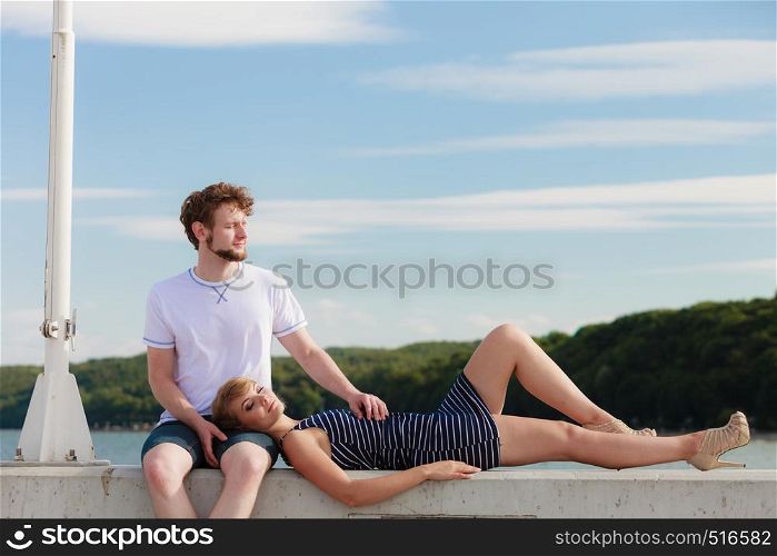 Romantic heterosexual couple in love relaxing peaceful outdoor enjoying sunlight good time