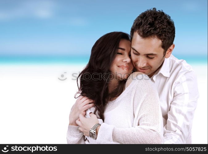 Romantic holidays for two, beautiful loving couple hugging on the beach, just married, summer vacation, love and romance concept