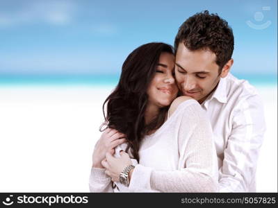 Romantic holidays for two, beautiful loving couple hugging on the beach, just married, summer vacation, love and romance concept